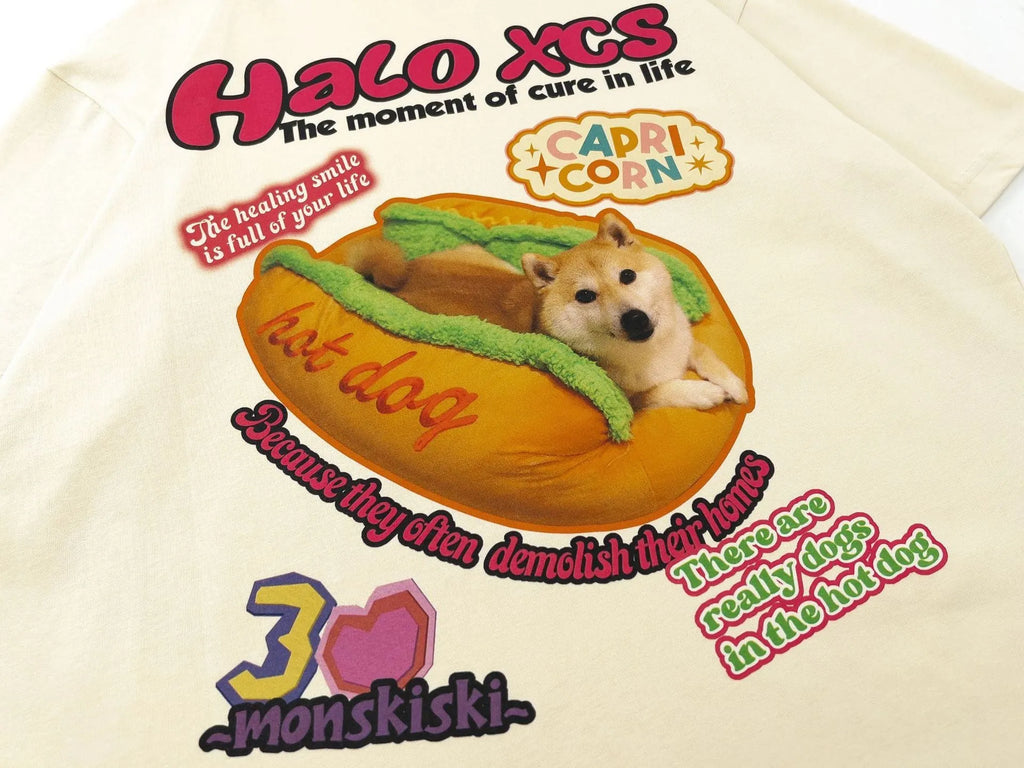 Cartoon hamburger dog printed short-sleeved cotton t-shirt in loose fit, shown in apricot colour.