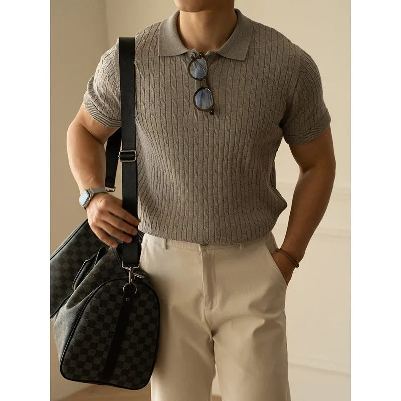 A man's khaki short-sleeve business commute top laid flat, showing its collar and sleeve detail.