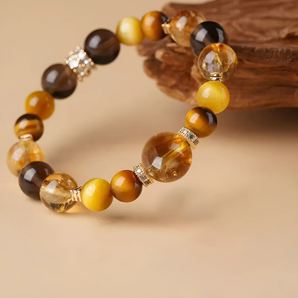 Tiger-eye crystal bracelet with Jinba symbol and geometric tower design in natural yellow