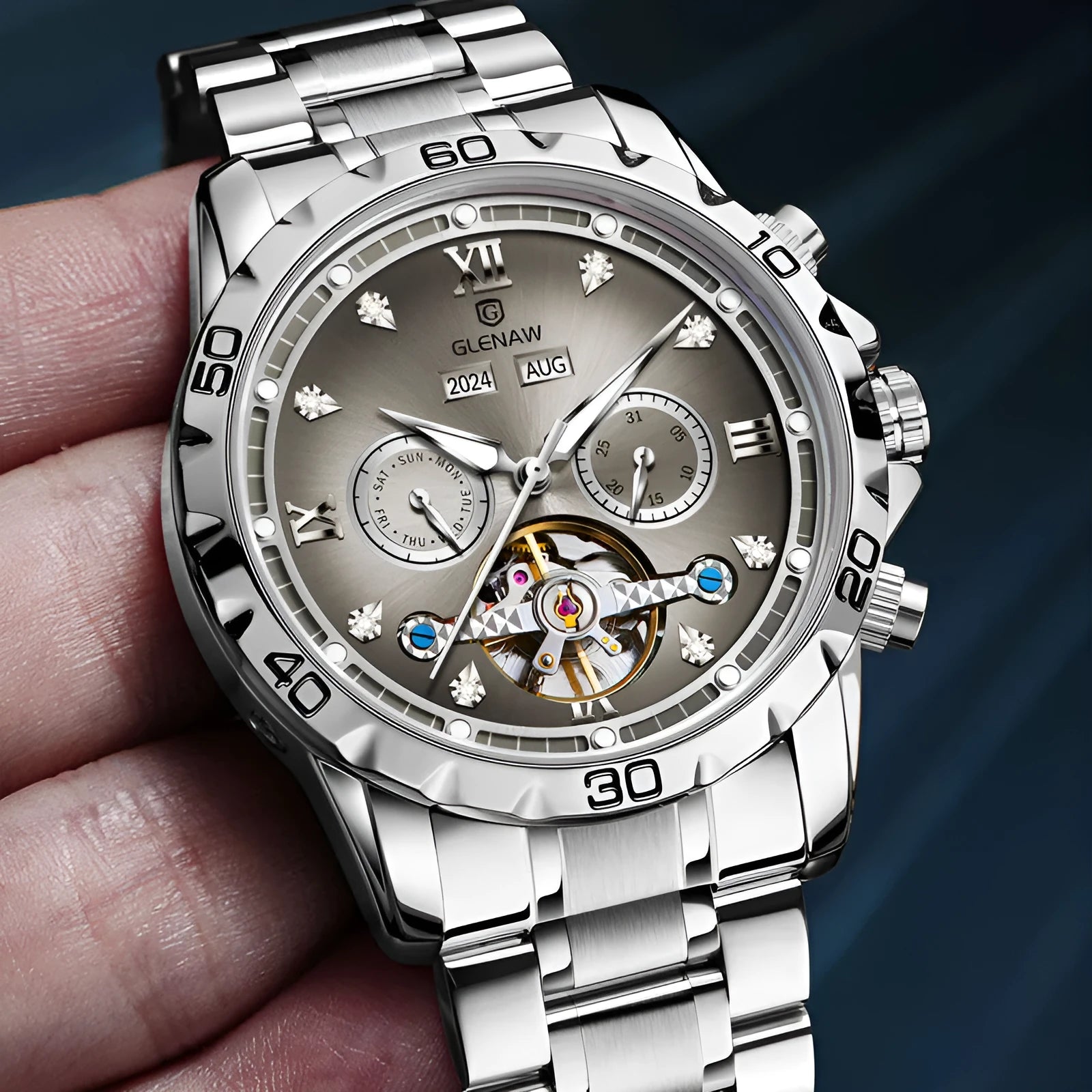 Men's automatic mechanical watch with stainless steel strap on wrist, showing blue dial and silver case variant.