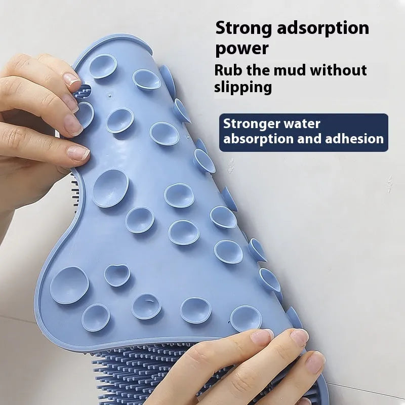 Blue silicone bath massage cushion mat with textured surface for handheld scrubbing.