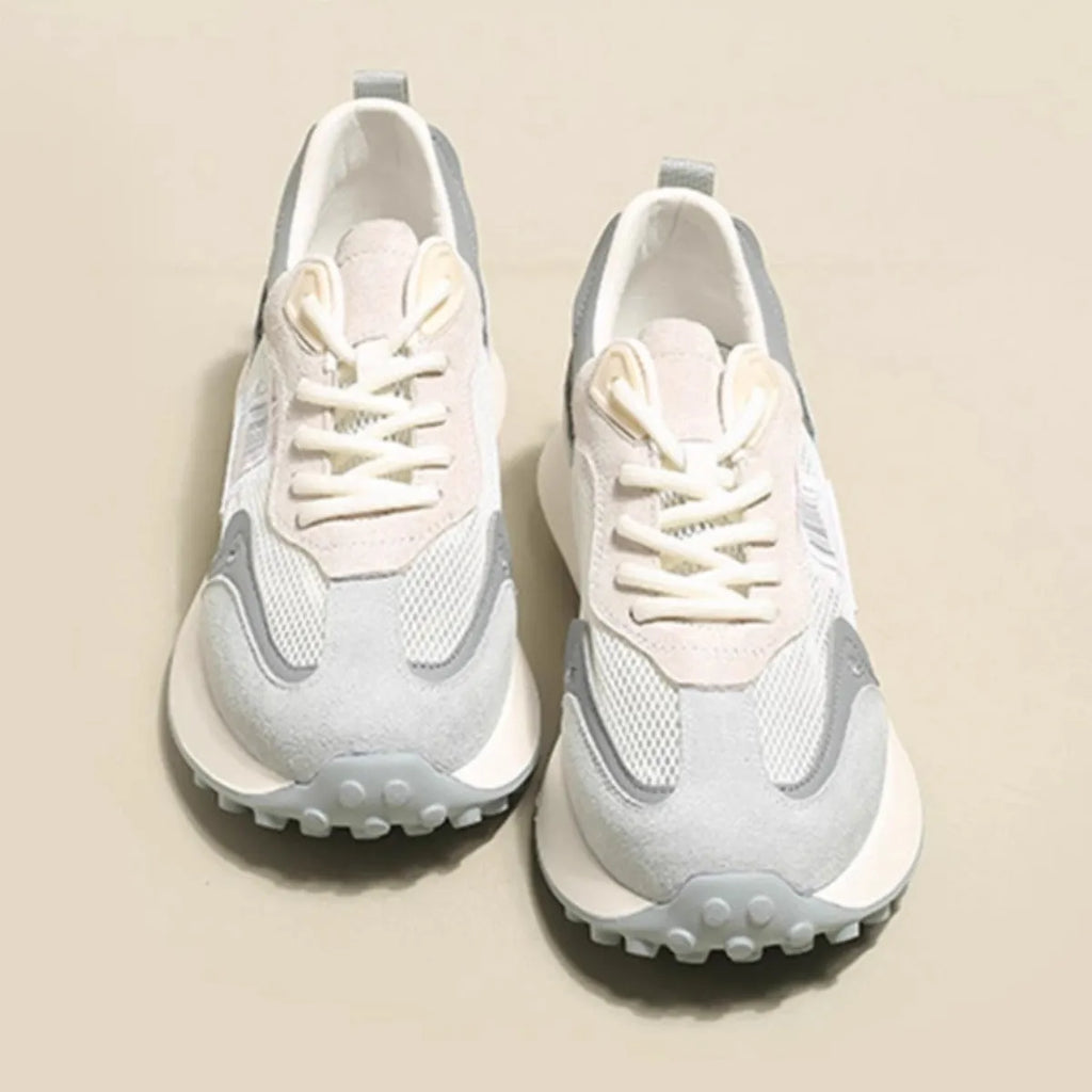 Women's casual retro sneaker in grey or pink with low-top design and round toe