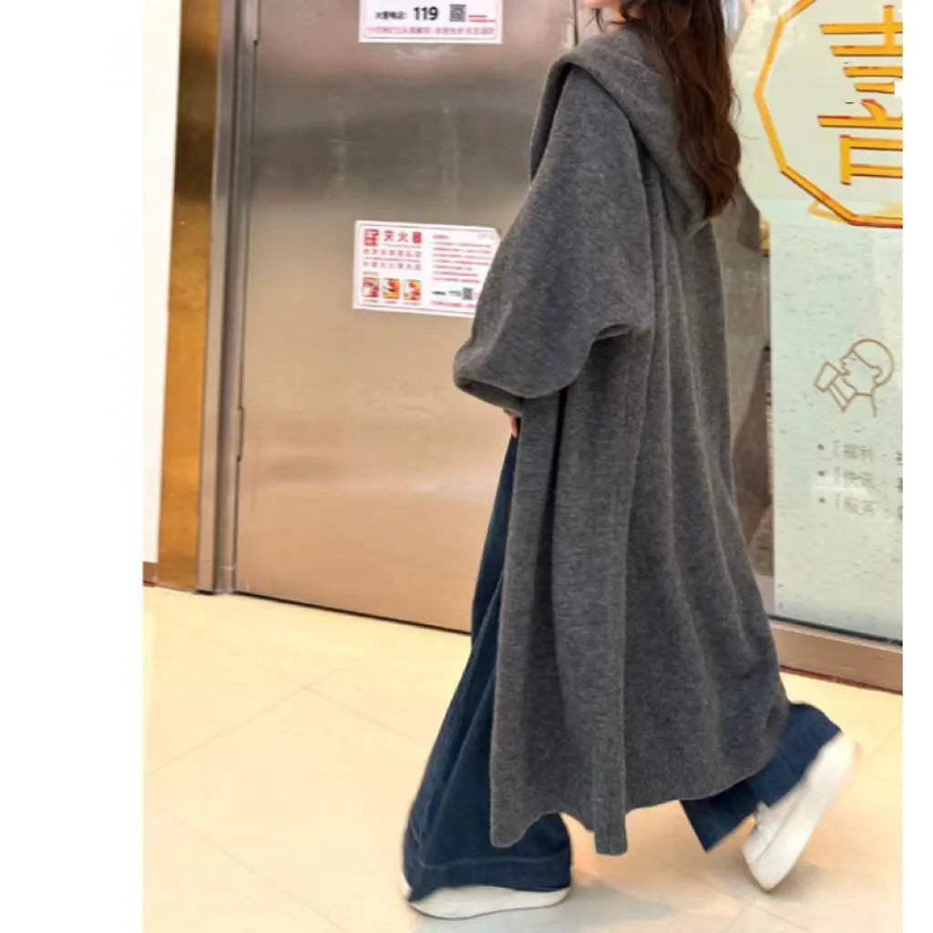 Korean style women's hooded knitted cardigan in wool blend fabric showing below-knee length and loose fit