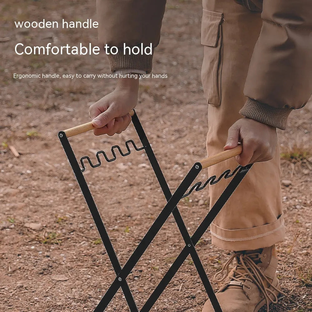 Black folding iron trash storage rack with a wooden handle holding a bin bag.