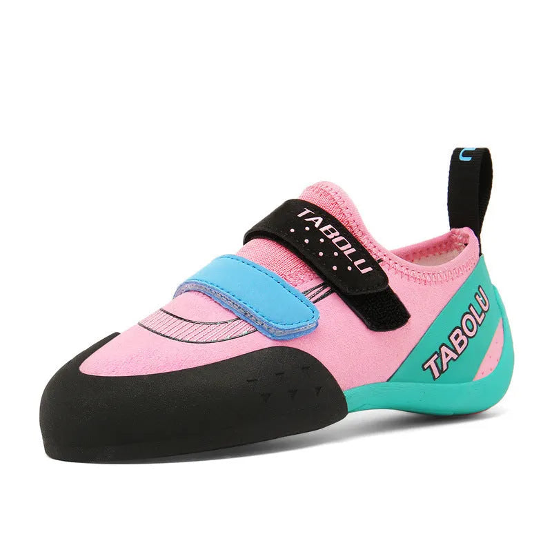 A pair of Velcro closure rock climbing shoes with a non-slip rubber sole in a black and red colour scheme.