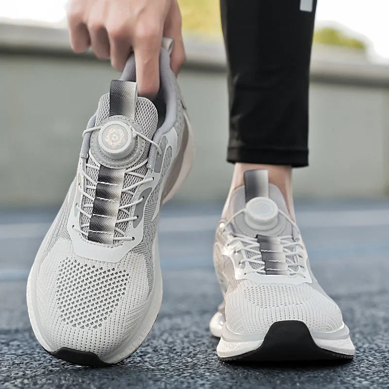 Men's white rotating buckle running shoe with Fly-knit mesh upper and low-top design.