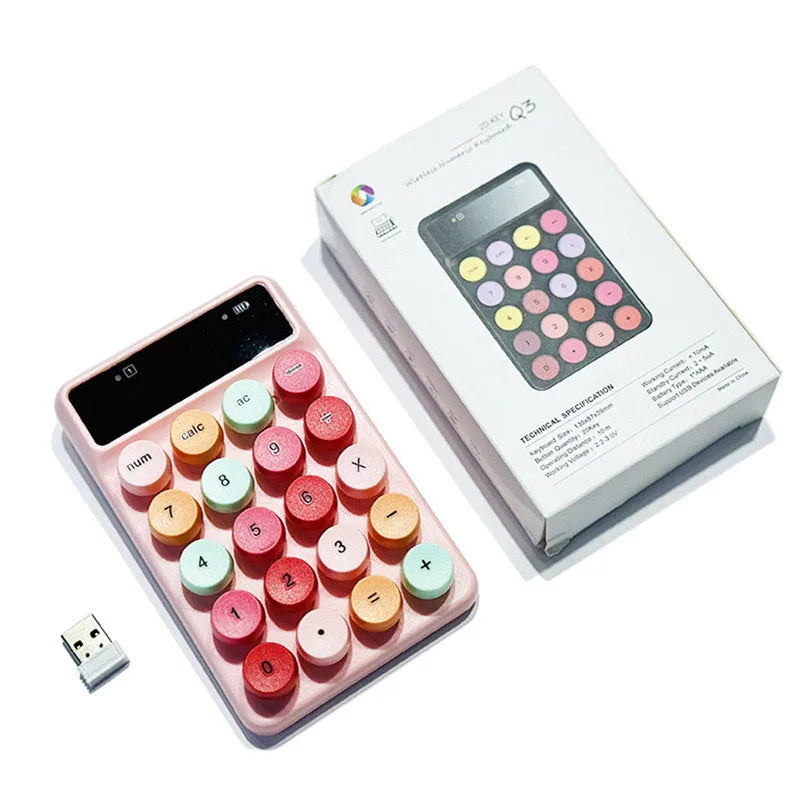 Q3 wireless digital keyboard in a macaron colour option on a desk.