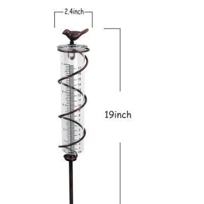 Cast iron garden rain gauge with hummingbird decoration showing 1-20 scale markings
