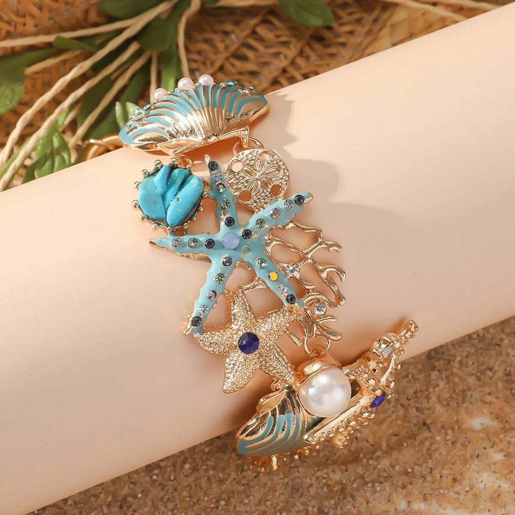 Women's alloy starfish bracelet in turquoise, coral red, or coral blue electroplated colour.