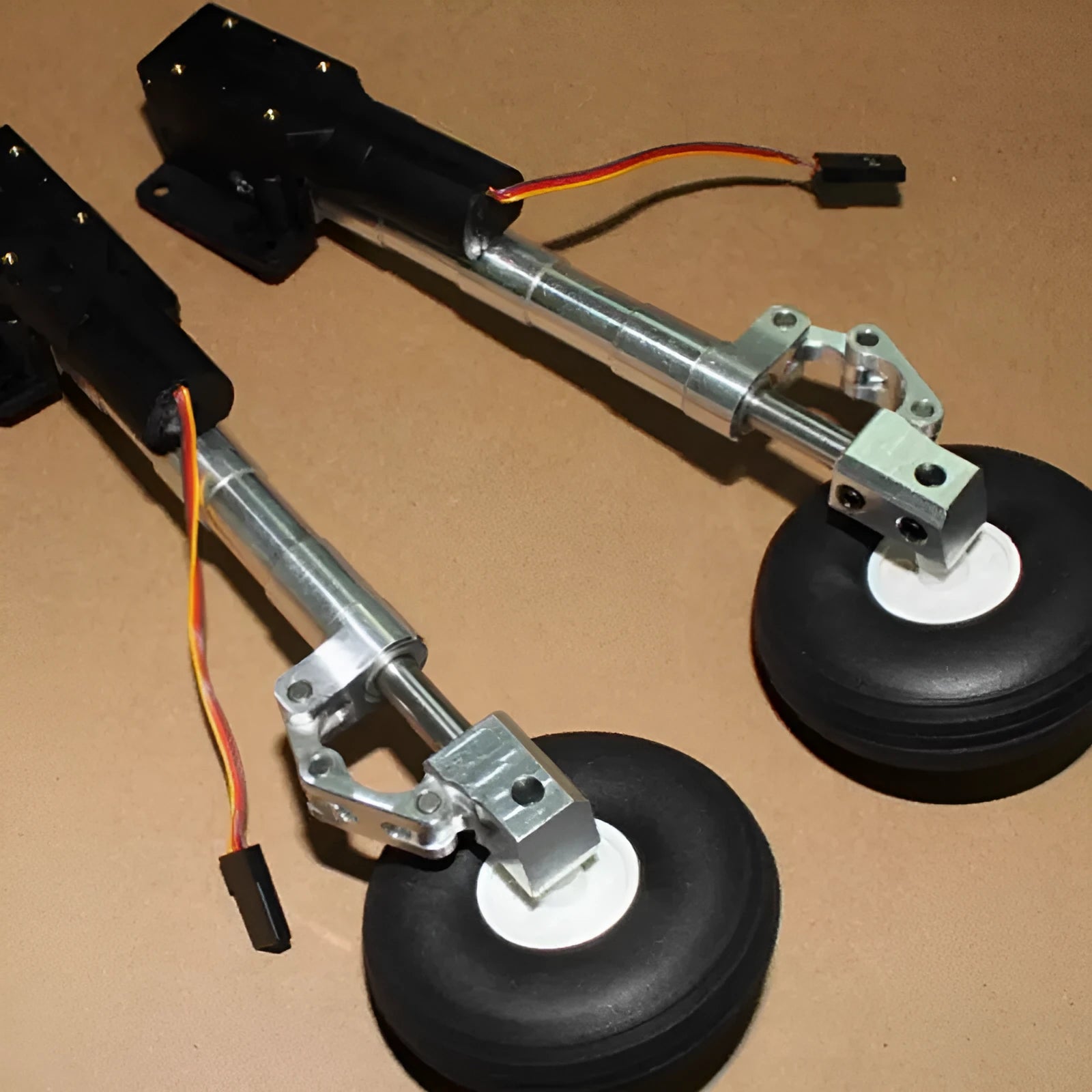 Alloy retractable shock-absorbing landing gear for remote control electric aircraft with wheel options