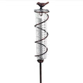 Cast iron garden rain gauge with hummingbird decoration showing 1-20 scale markings
