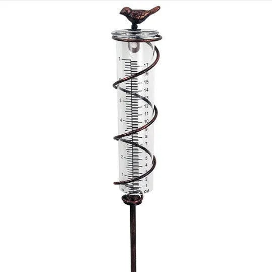 Cast iron garden rain gauge with hummingbird decoration showing 1-20 scale markings