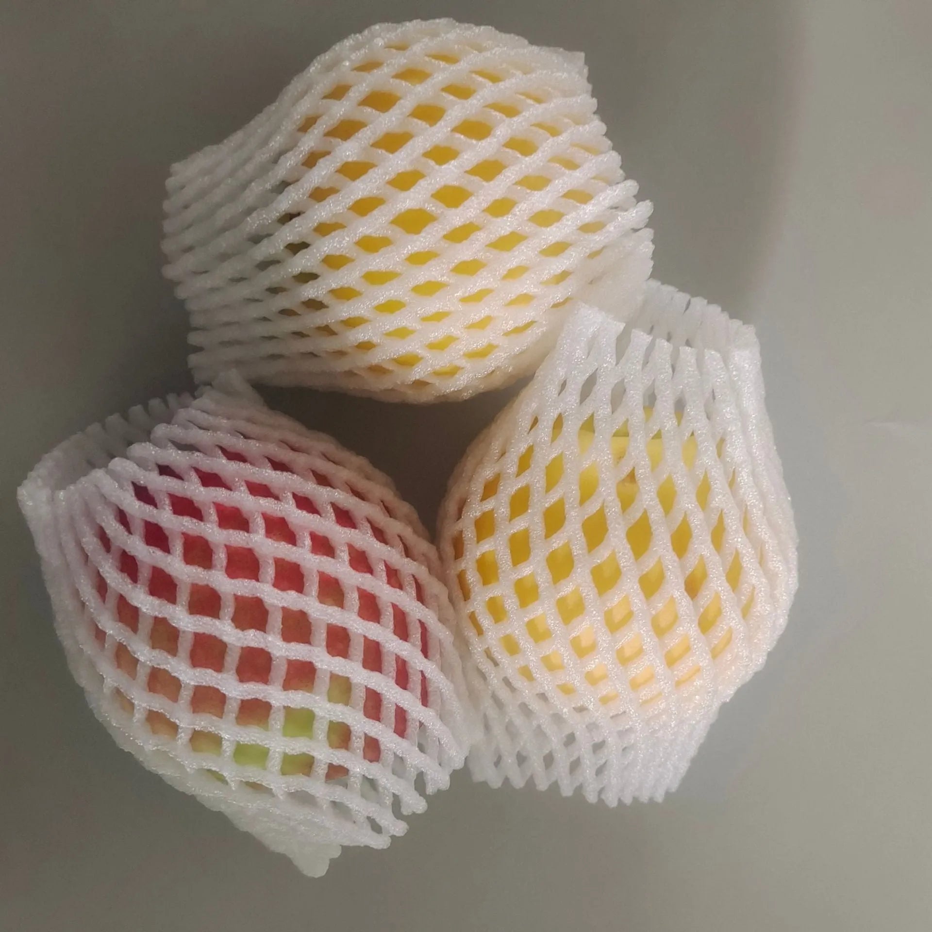 White foam fruit net protective cover with hybrid construction for shockproof fruit safeguarding