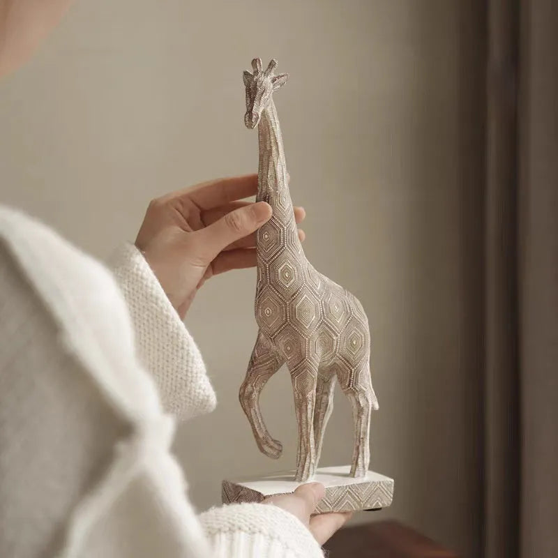 Wood colour synthetic resin giraffe ornament measuring 30.5 cm tall on a shelf.