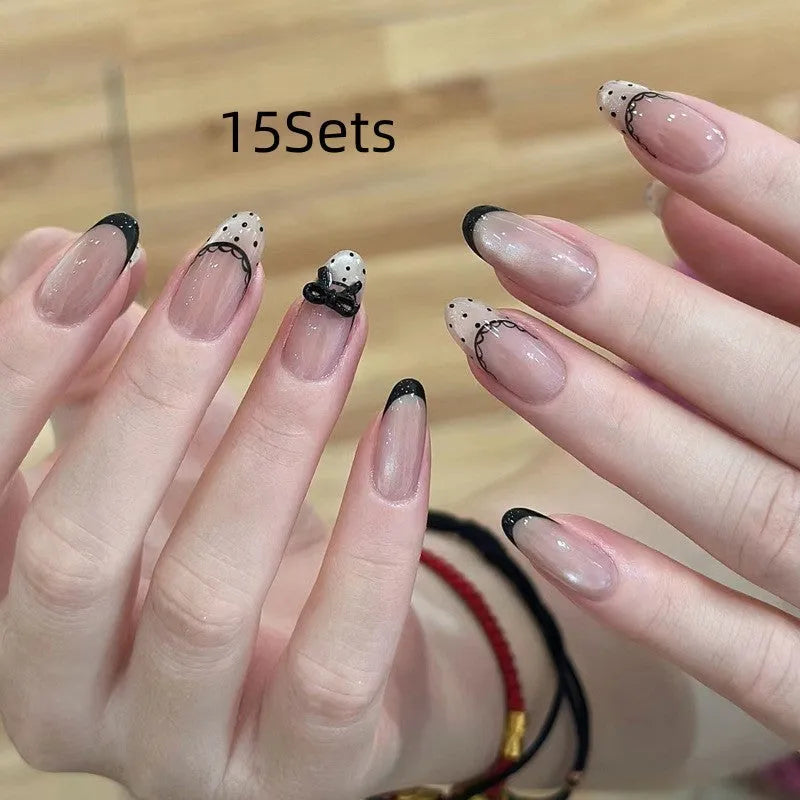 Set of sweet girl themed press-on false nails in assorted random colours and designs.