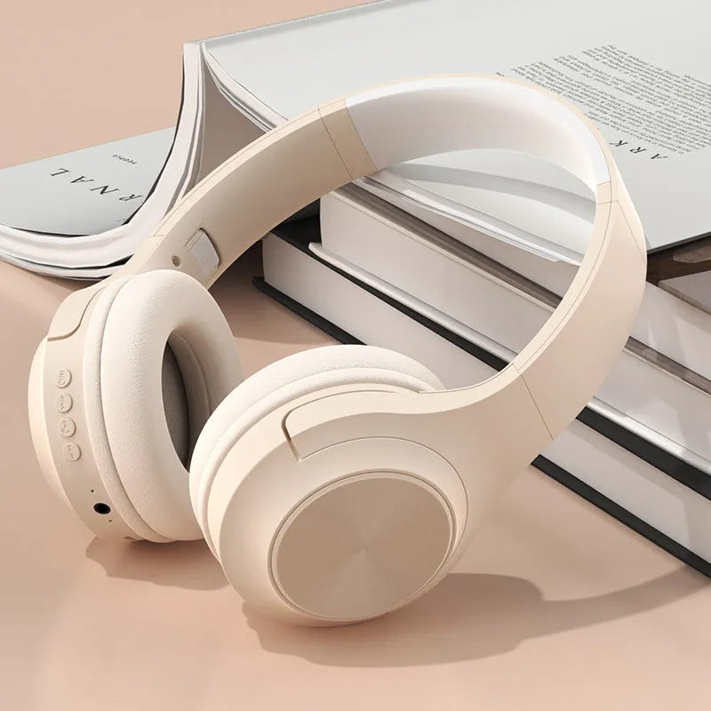 Creative wireless Bluetooth headset in Ivory White colour with head-mounted design and charging case