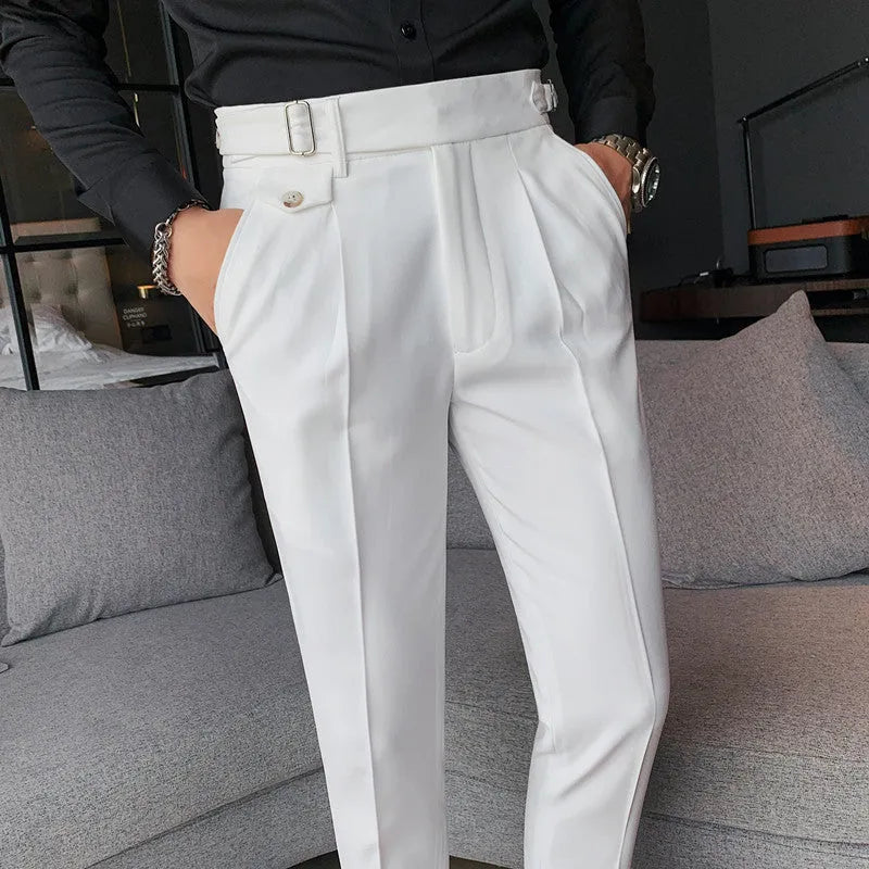 Straight-leg casual trousers in a neutral colour on a hanger, showing the simple fit and polyester fabric.