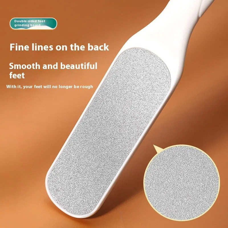 Stainless steel foot grinder tool with white and black double-sided abrasive files for callus removal.