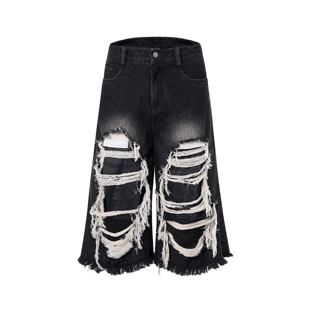 Black loose fit wide leg cropped jeans with a mid-high waist on a model.