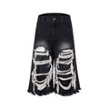 Black loose fit wide leg cropped jeans with a mid-high waist on a model.
