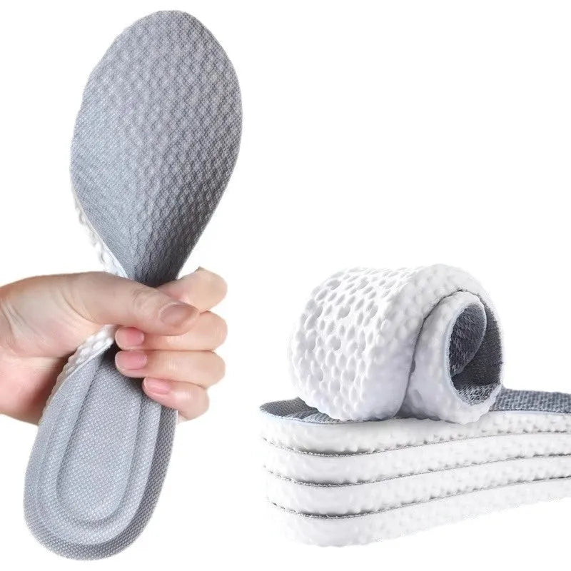 Grey, black, and orange breathable PU foam sports insoles that can be cut to fit shoe size.