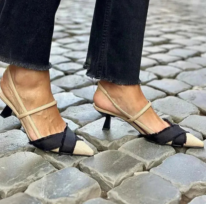 Women's apricot and black colour block stiletto heel sandals with a pointed toe and buckle fastening.