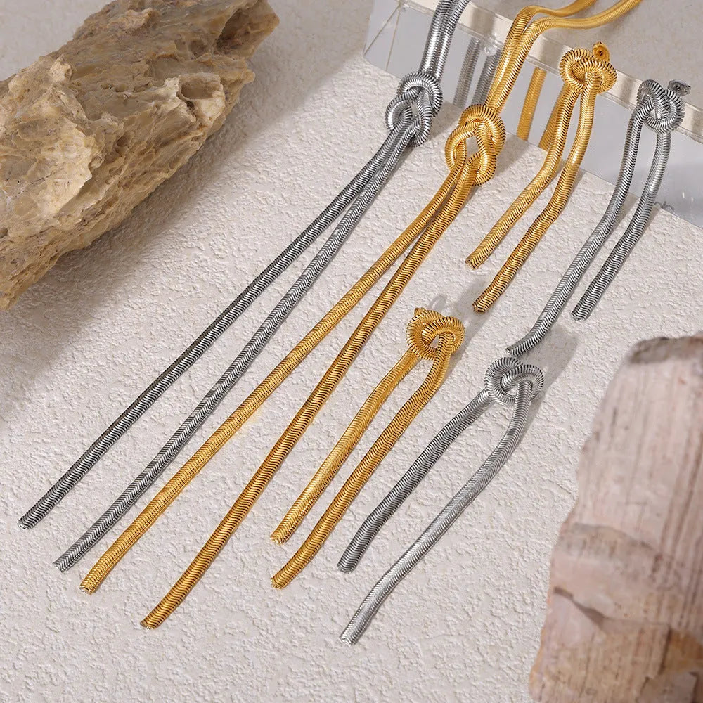 Gold knotted tassel pendant on titanium steel snake chain necklace with matching electroplated earrings