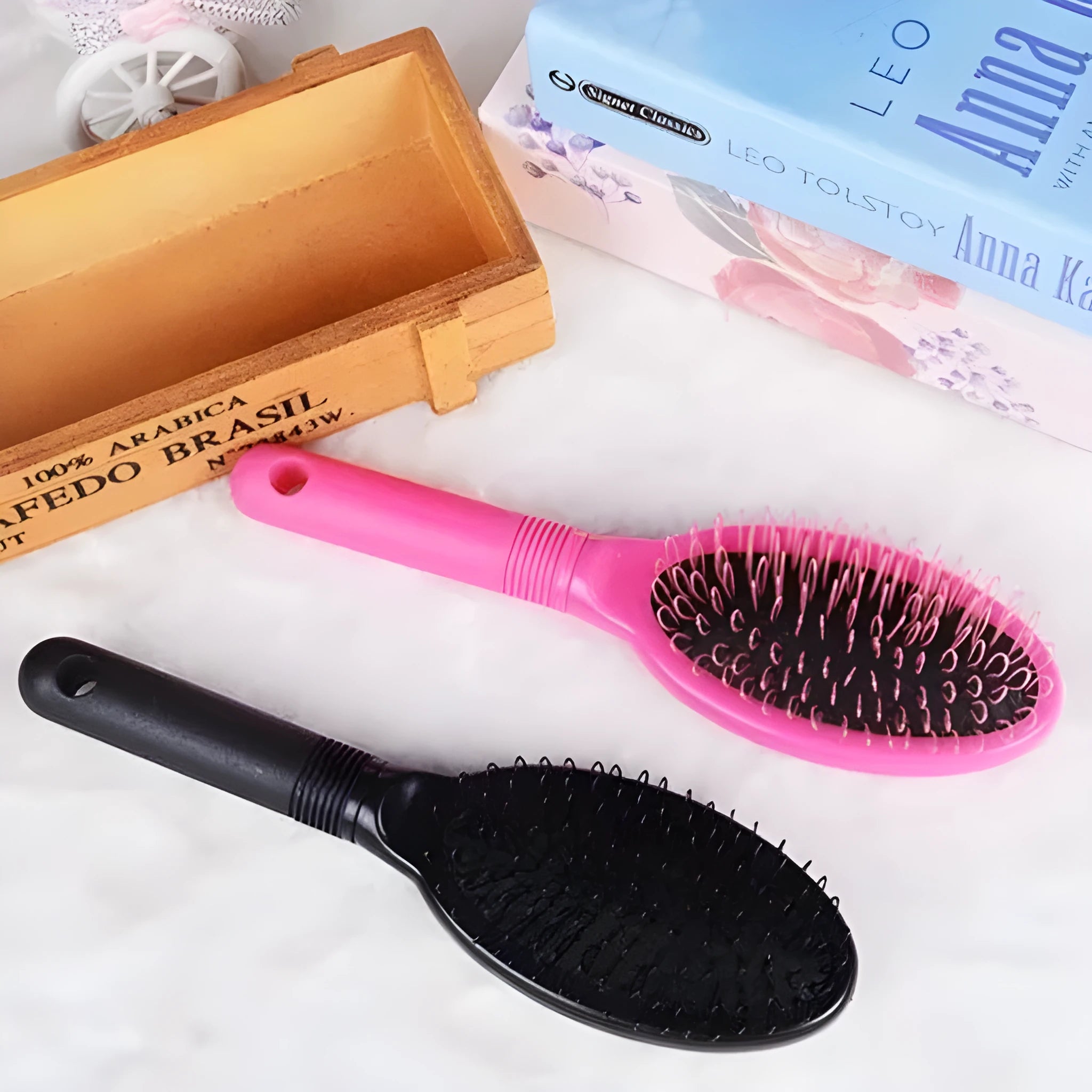 Black and pink ABS plastic ring tooth hair extension comb with airbag cushion base.