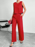 Red women's two-piece set with sleeveless top and wide leg trousers