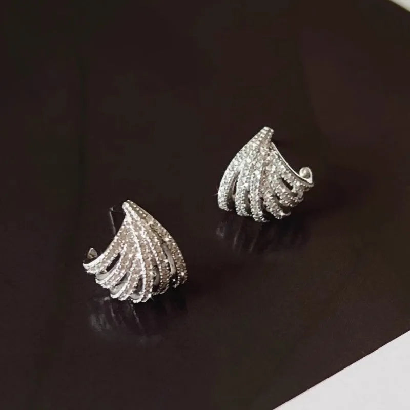 Geometric zircon earrings with platinum electroplated finish and line design details