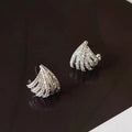 Geometric zircon earrings with platinum electroplated finish and line design details