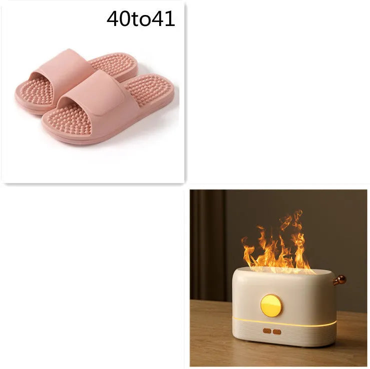 Black USB-powered desktop humidifier with glowing orange flame effect and water vapour mist.