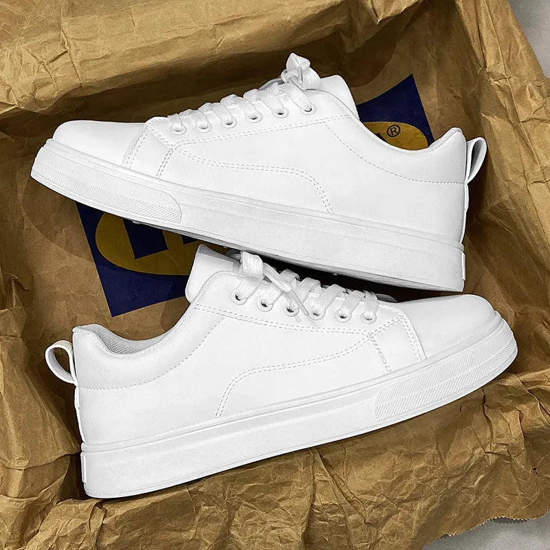 Men's low-top Korean-style sneakers in white, black, and black with white sole colours on a plain background.