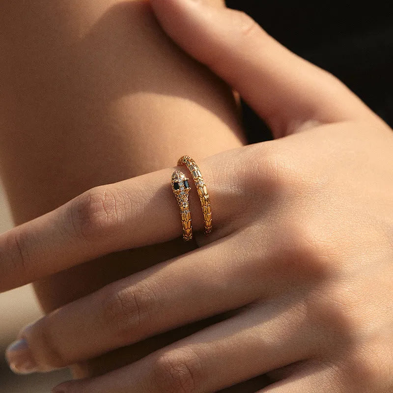 Snake-shaped adjustable copper ring with 18K gold colour retention plating on index finger
