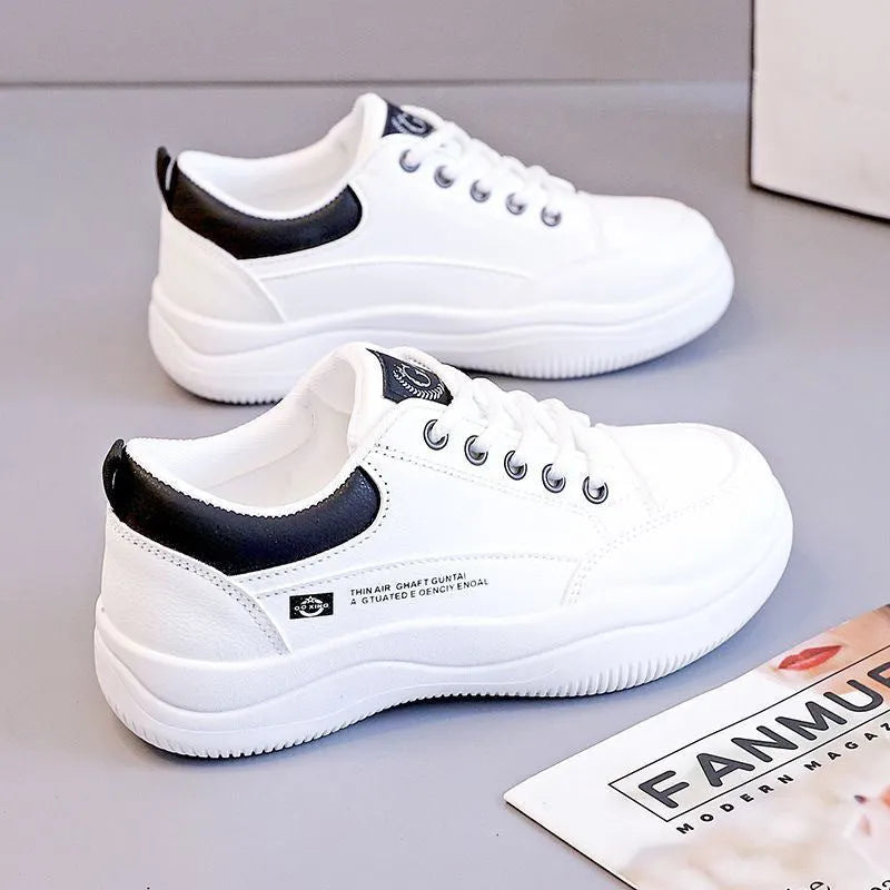Women's white Korean-style lace-up shoes with cross-strap detailing and flat mid heel