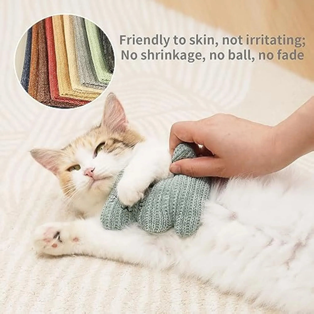 Cyan knitted plush cat toy with rope and bell, shown next to a light coffee colour option.