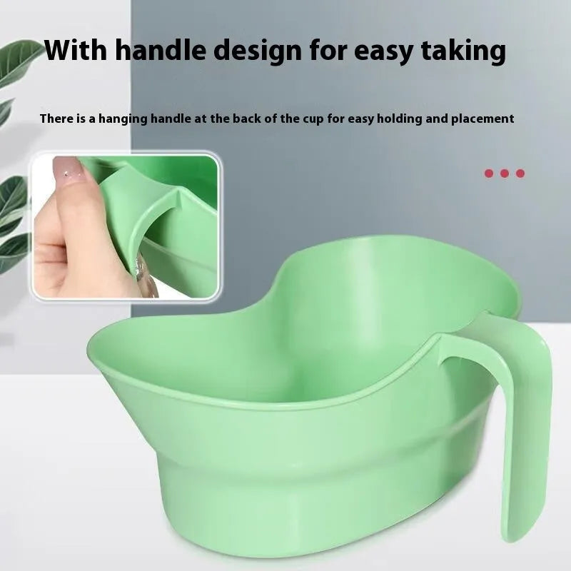 Green plastic gargle cup with spout for bedridden patient oral care