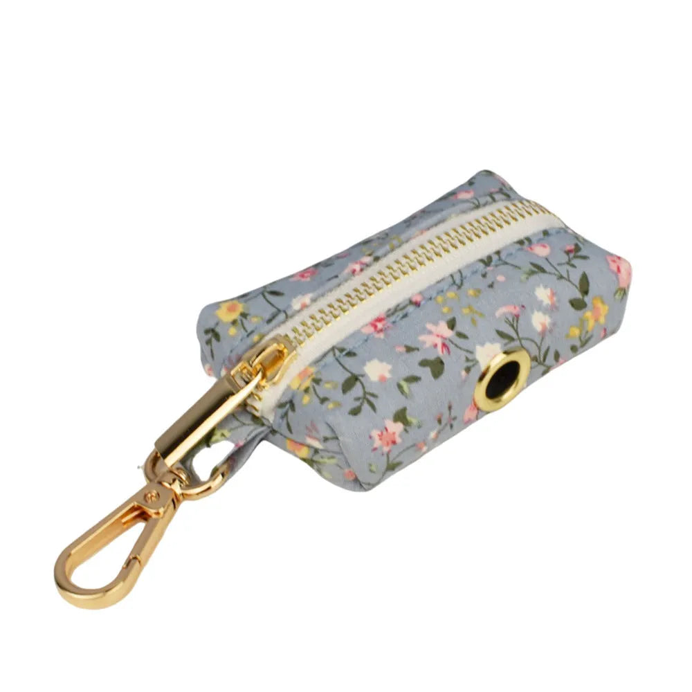 Blue floral pattern dog collar made from polyester cotton fabric with adjustable strap and decorative bow accessory.