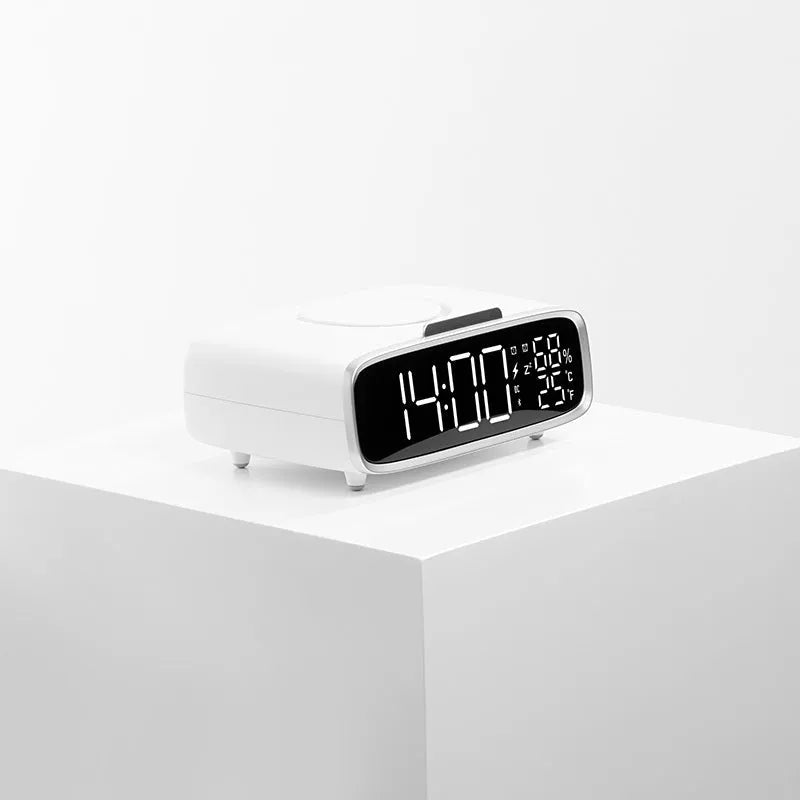 White wireless charging Bluetooth speaker with night light function on bedside table