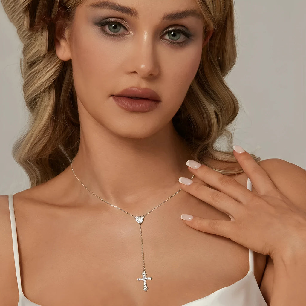 Simple silver love cross pendant necklace with O-ring chain on a female model, colour BSN384.