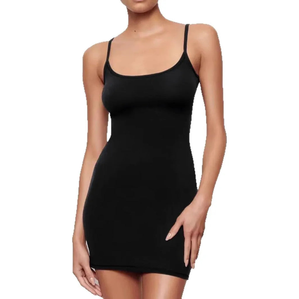 Black slim-fit sheath dress with sling neckline and sleeveless design on a mannequin.