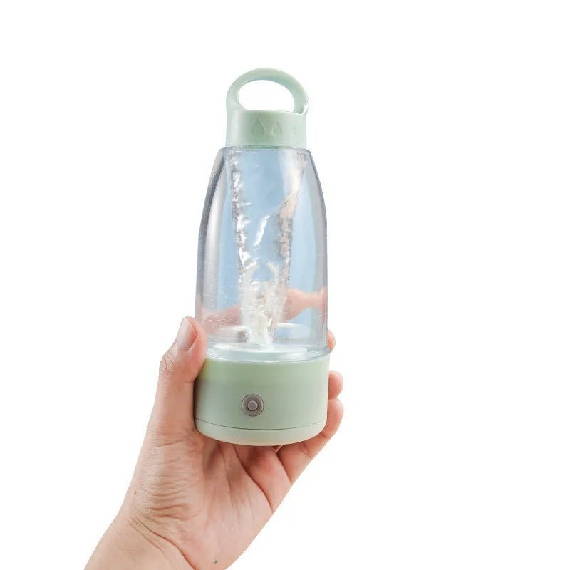 Automatic electric shaker bottle in green, pink, or white with USB charging port and carry handle.