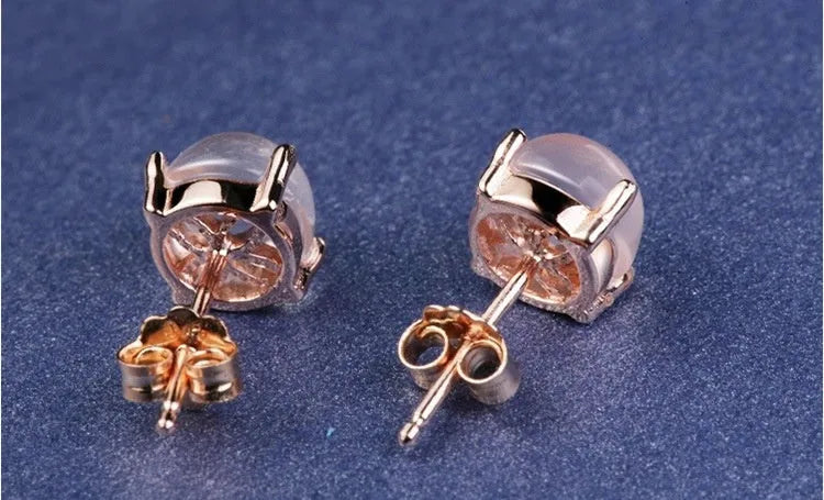 Rose gold drop shape stud earrings with synthetic quartz crystal inlay