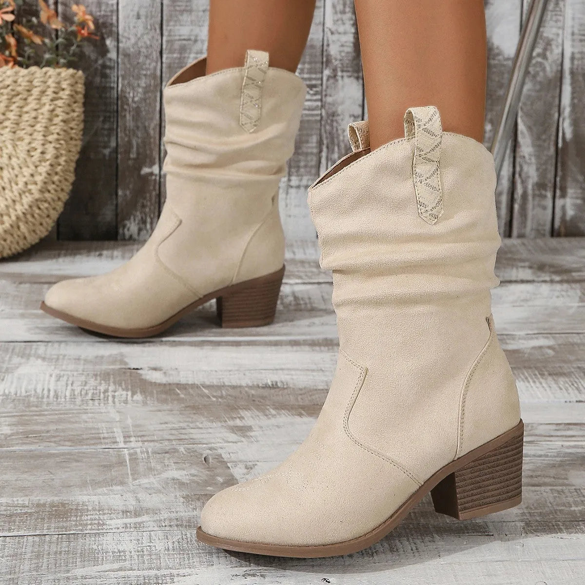 Women's suede mid-calf boot in lotus root colour with leather stitching and a short stout heel.