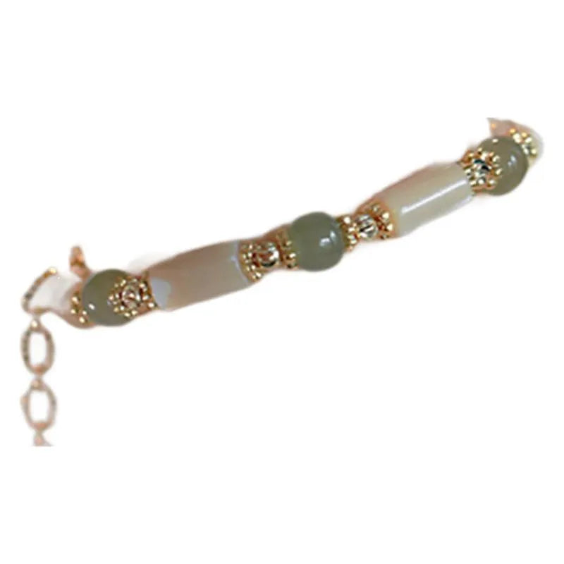 Handmade Hetian jade white lip shell bracelet with round beads on wrist