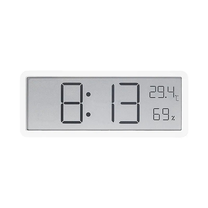 Simple large screen temperature and humidity clock with plastic shell in white Nordic style on a desk