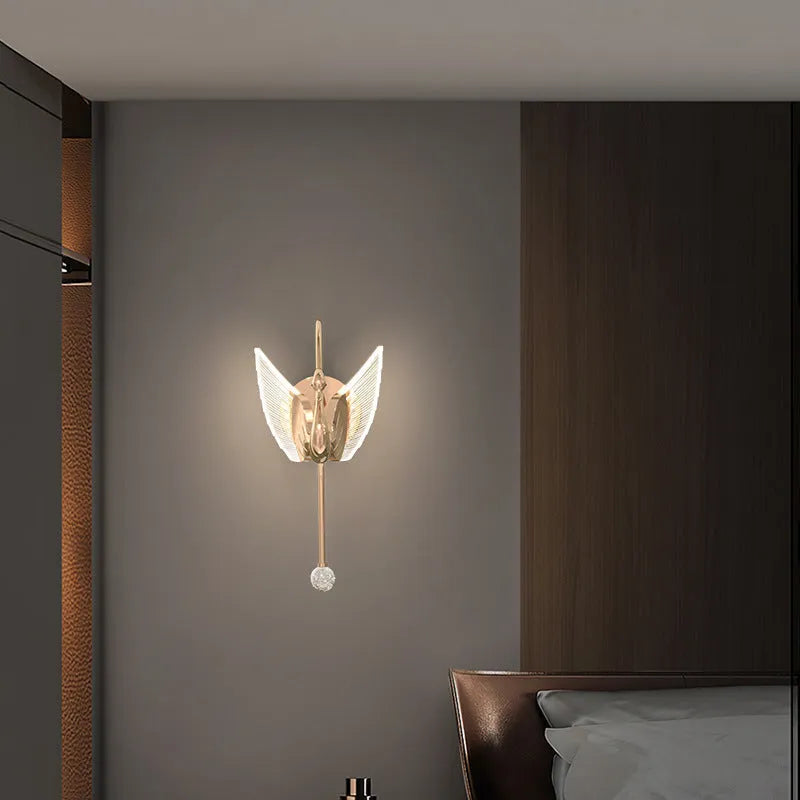 Gold minimalist swan-shaped wall lamp with acrylic shade and dimmable LED light.