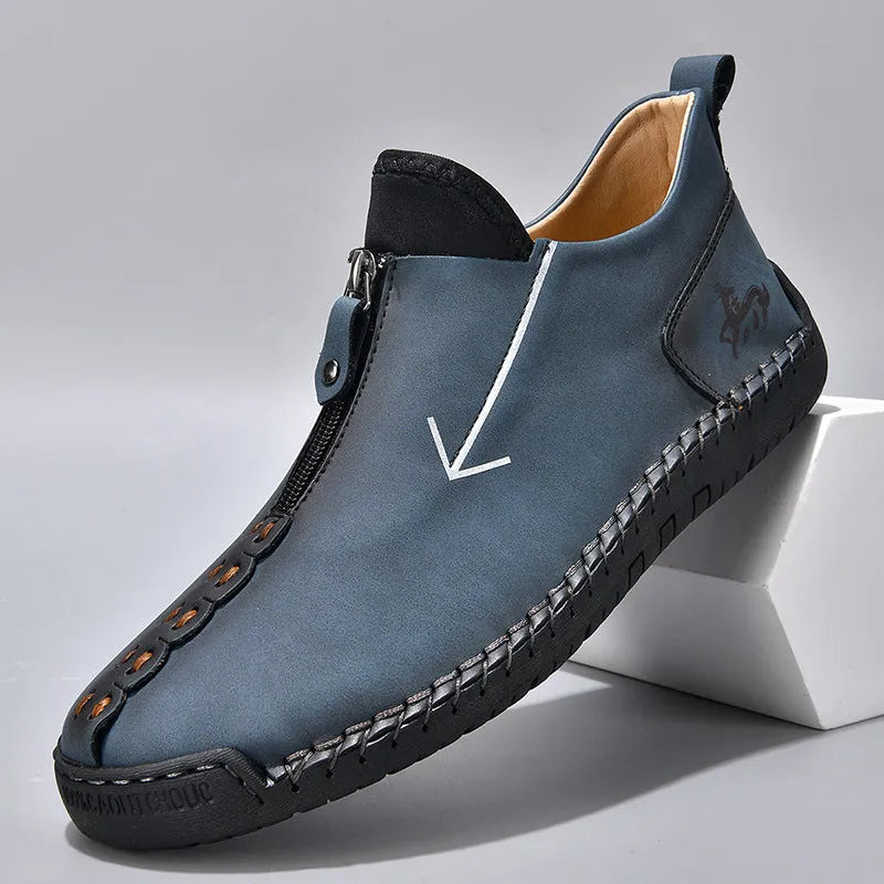 Men's black front-zipper casual leather-style boots with round toe and hand-stitched detail on a white background.