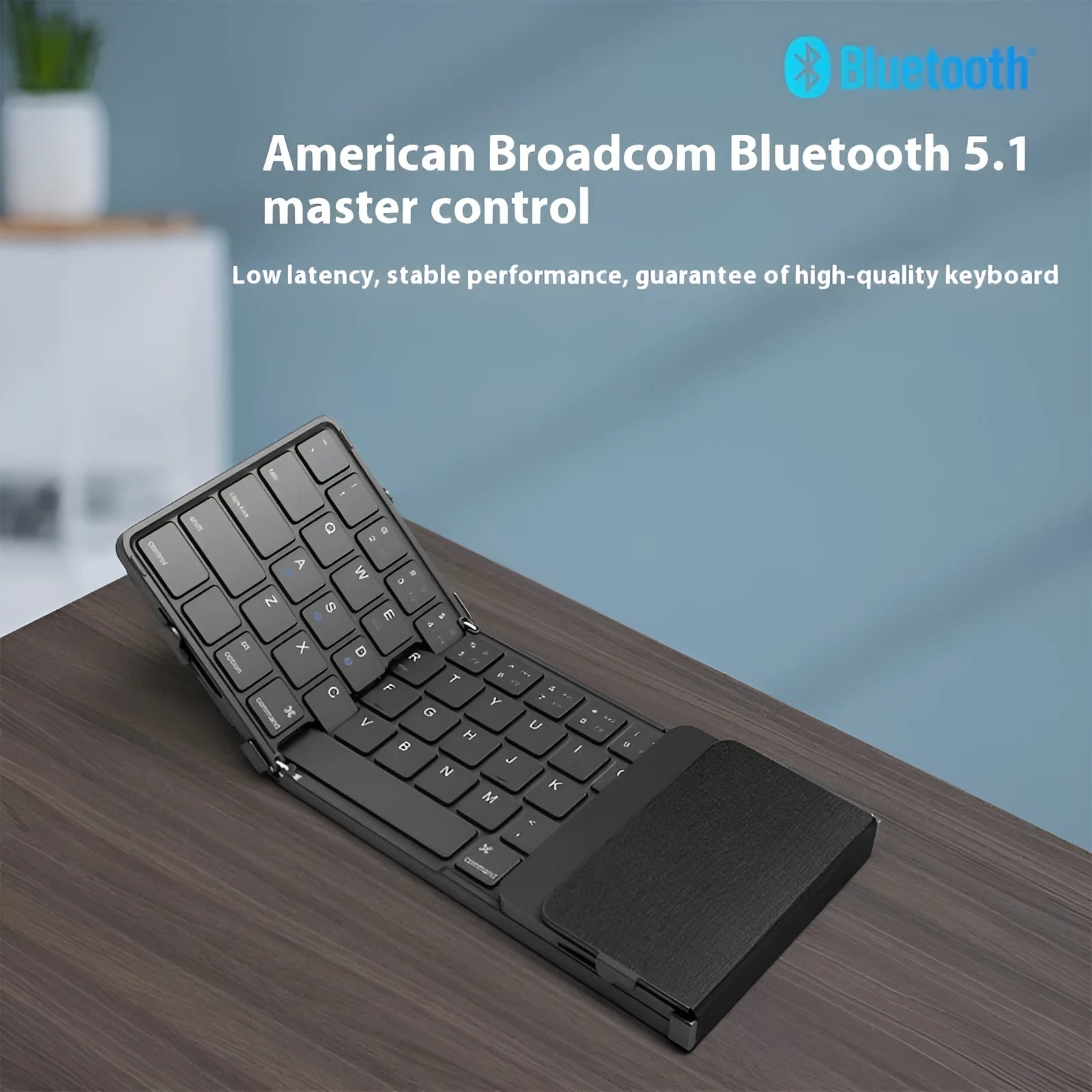 Black folding Bluetooth keyboard for mobile phones and tablets showing folded and unfolded positions