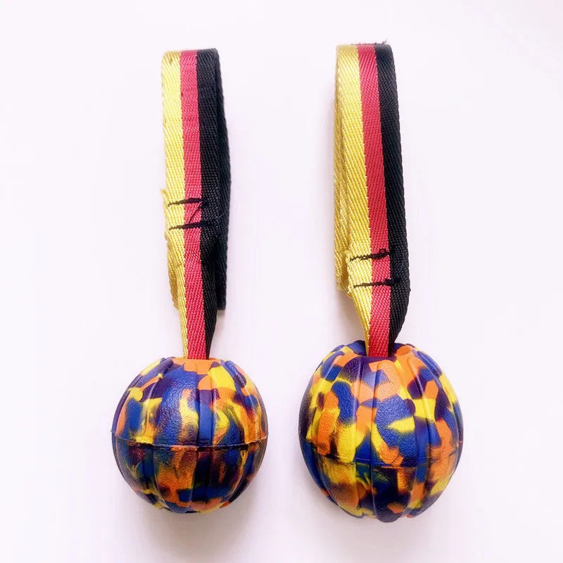 EVA floating dog training ball in camouflage and yellow colours showing three different diameter sizes
